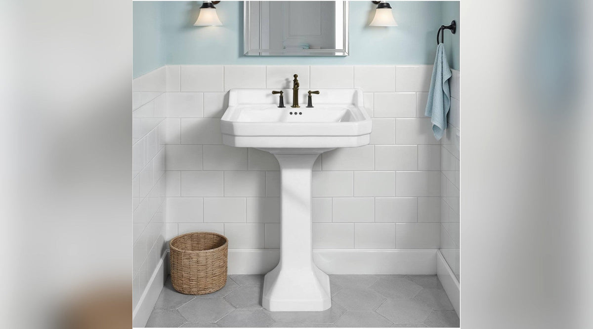 Emile 60cm pedestal basin in white in a tiled bathroom